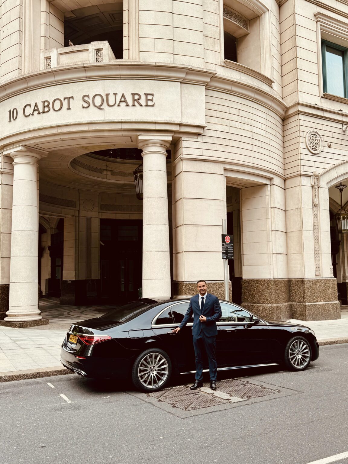 DNA chauffeur beside an S-Class at Cabot Square